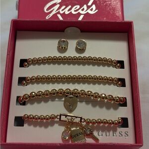 Guess bracelet and earrings set.